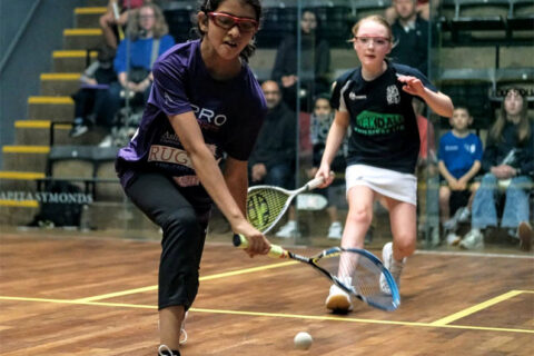 Two girls playing in the finals of the 2022 British Junior Championships