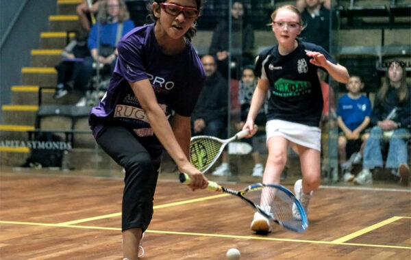 Two girls playing in the finals of the 2022 British Junior Championships